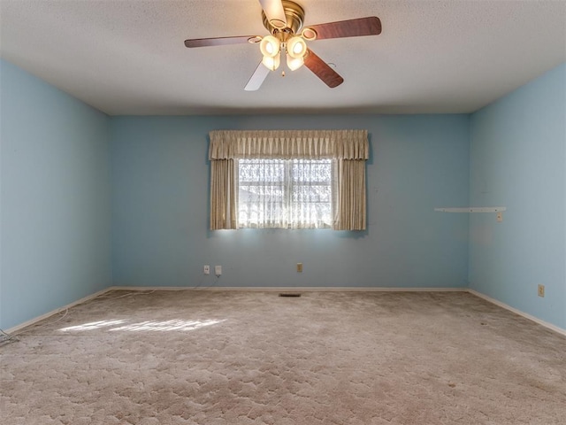 7000 N Libby Ave, Oklahoma City, OK 73132 - unfurnished room featuring carpet floors, a textured ceiling, and ceiling fan