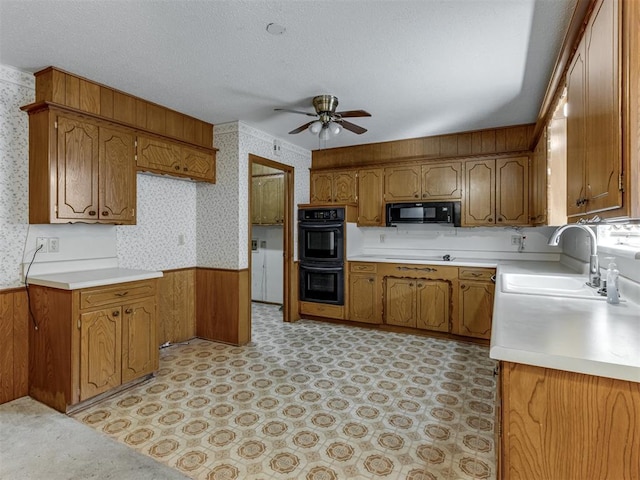 7000 N Libby Ave, Oklahoma City, OK 73132 - kitchen featuring ceiling fan, sink, a textured ceiling, and black appliances