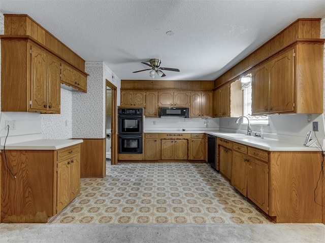 7000 N Libby Ave, Oklahoma City, OK 73132 - kitchen featuring ceiling fan, sink, a textured ceiling, and black appliances