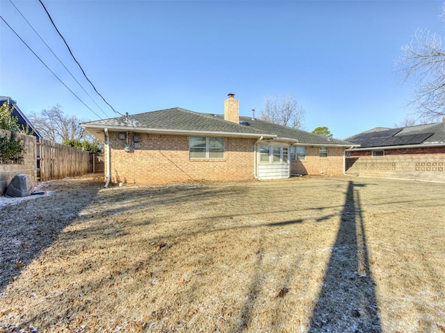 7000 N Libby Ave, Oklahoma City, OK 73132 - rear view of property featuring a lawn