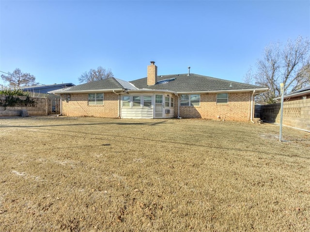 7000 N Libby Ave, Oklahoma City, OK 73132 - back of house featuring a yard
