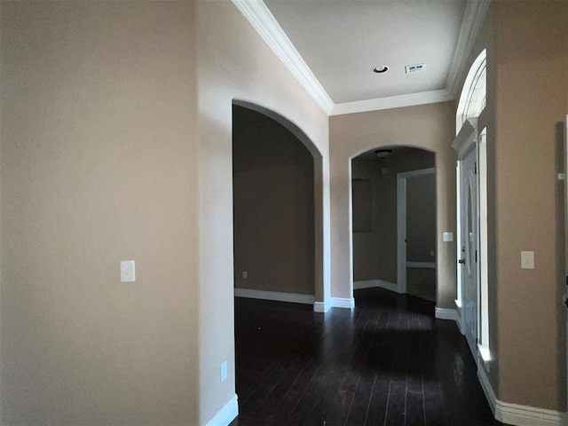 hallway featuring ornamental molding and dark wood-type flooring