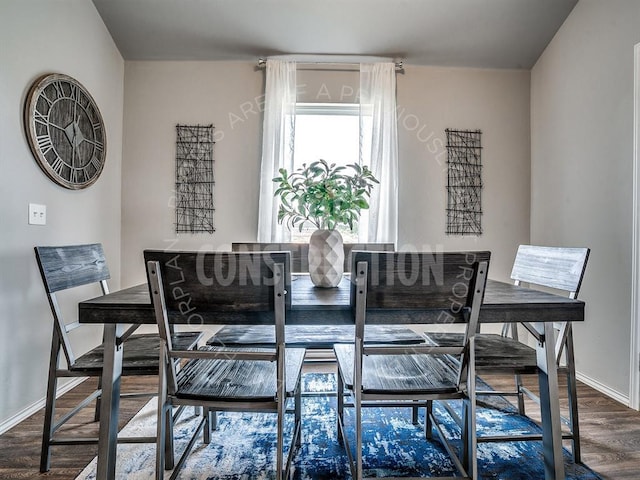 dining space featuring wood-type flooring