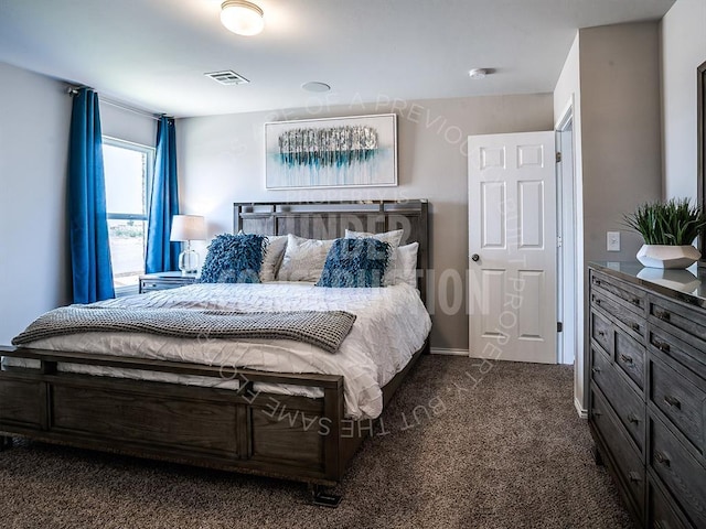 bedroom with dark colored carpet