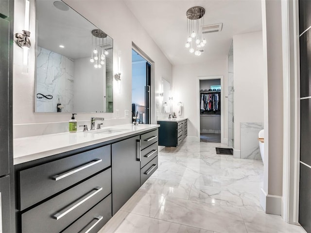 bathroom featuring vanity and an inviting chandelier