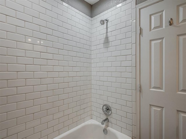 bathroom with shower / bathtub combination