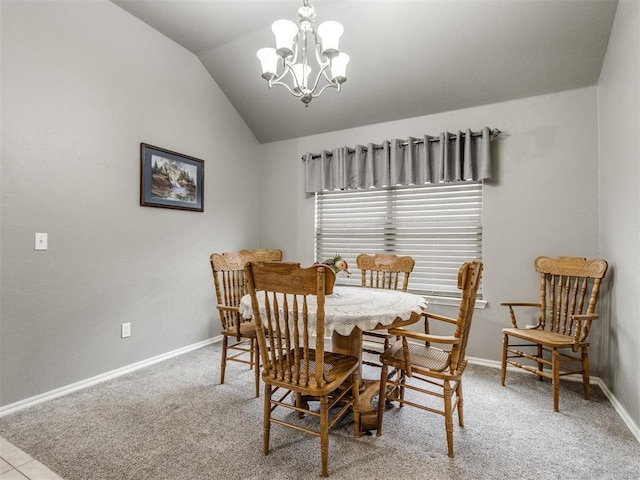 dining area featuring lofted ceiling, light carpet, a chandelier, and baseboards