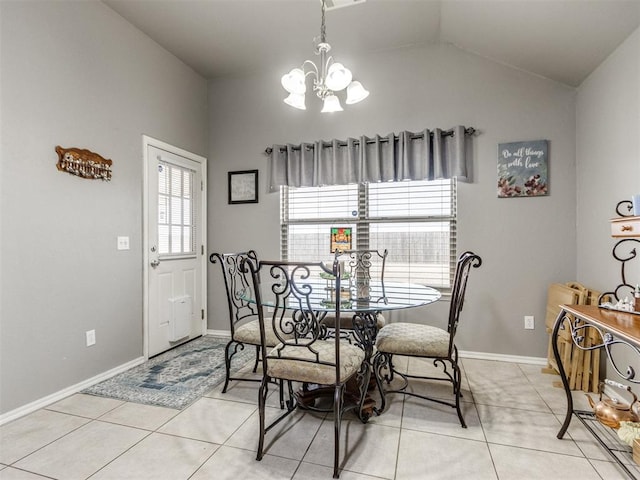 dining room with a chandelier, vaulted ceiling, baseboards, and light tile patterned floors