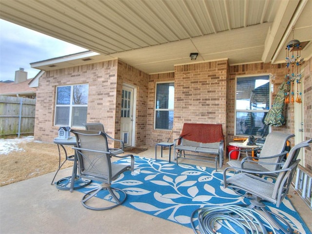 view of patio / terrace featuring fence