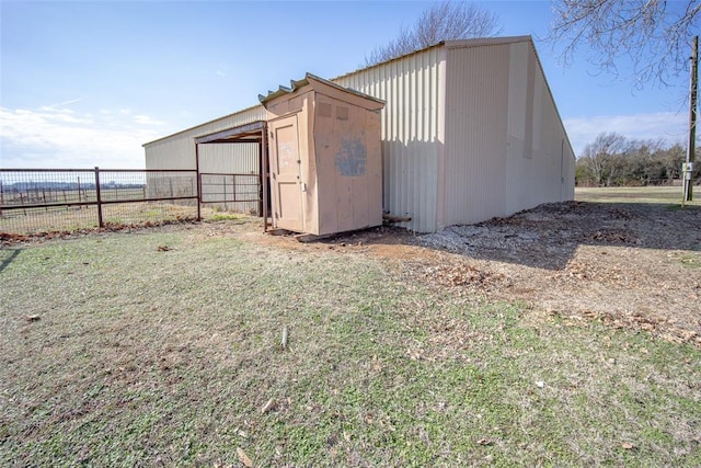 view of outdoor structure featuring a lawn