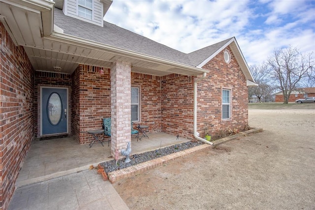 entrance to property with a patio