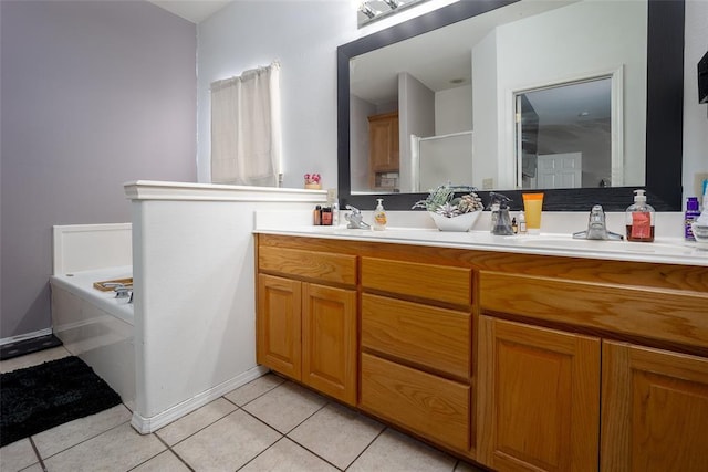 bathroom with tile patterned flooring, vanity, and independent shower and bath