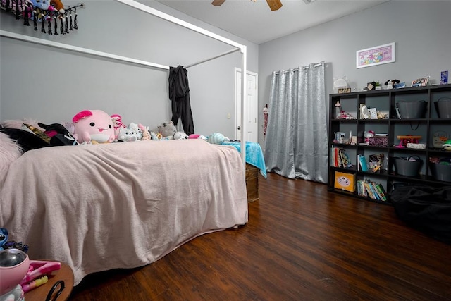 bedroom with ceiling fan and dark hardwood / wood-style floors