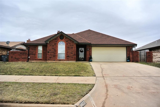 single story home featuring a garage and a front lawn