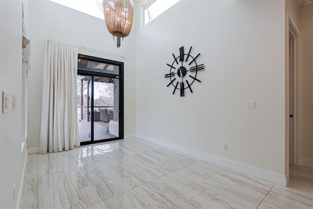 empty room featuring a high ceiling