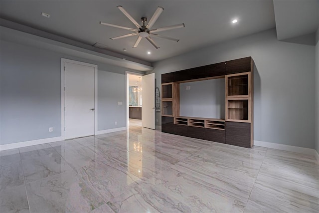 unfurnished living room with ceiling fan