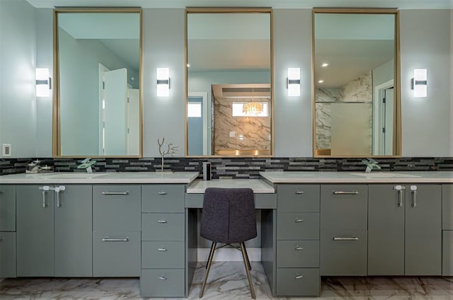 bathroom featuring vanity and backsplash