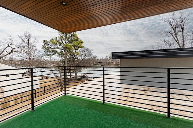 view of yard featuring a water view and a balcony