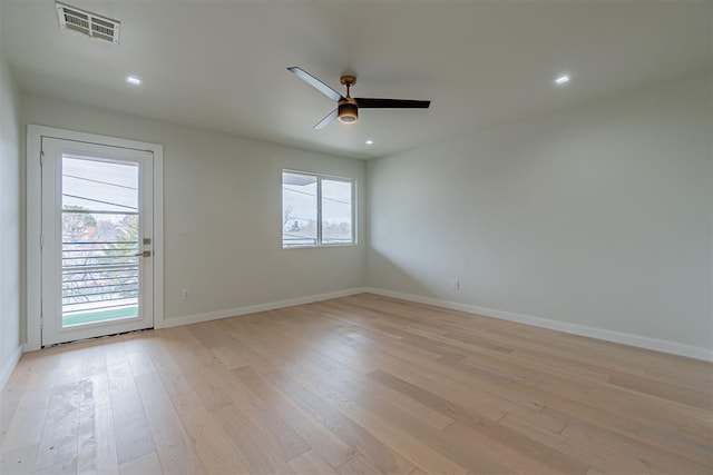 spare room featuring ceiling fan and light wood-type flooring