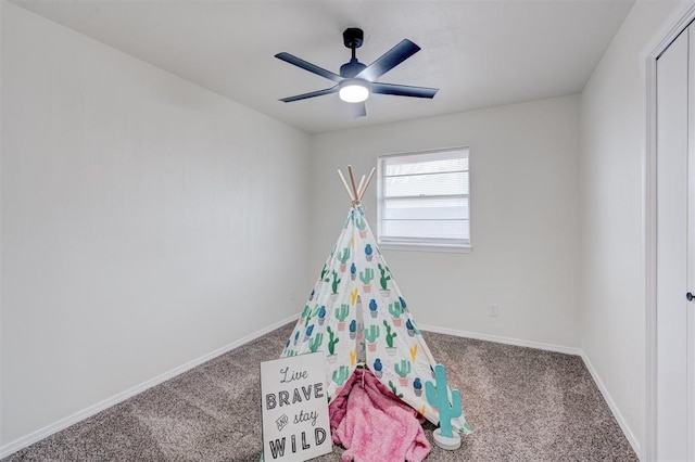 playroom with ceiling fan and carpet floors