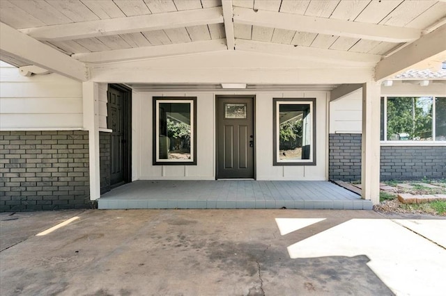 property entrance with a patio