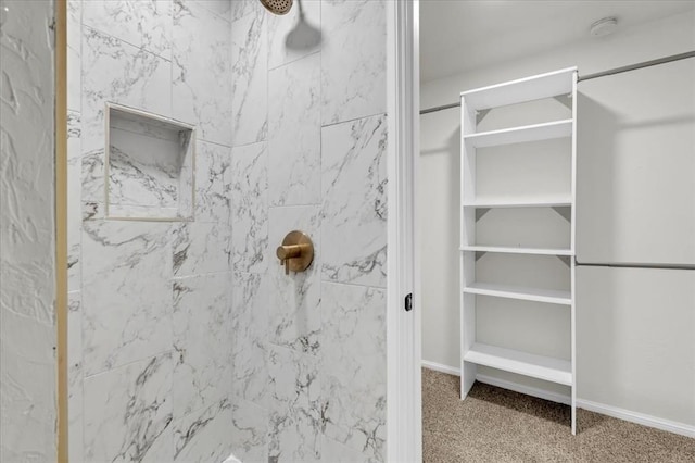 bathroom with a tile shower