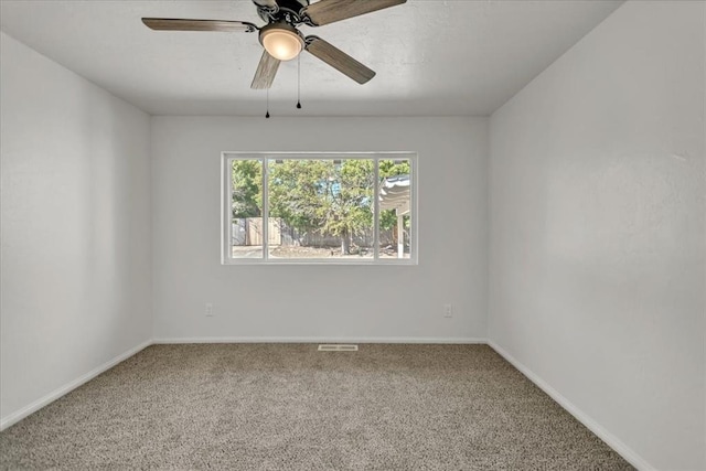 carpeted empty room with ceiling fan