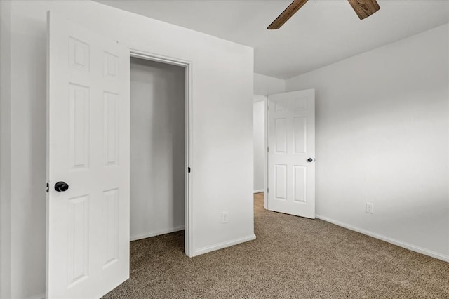 unfurnished bedroom with carpet floors and ceiling fan