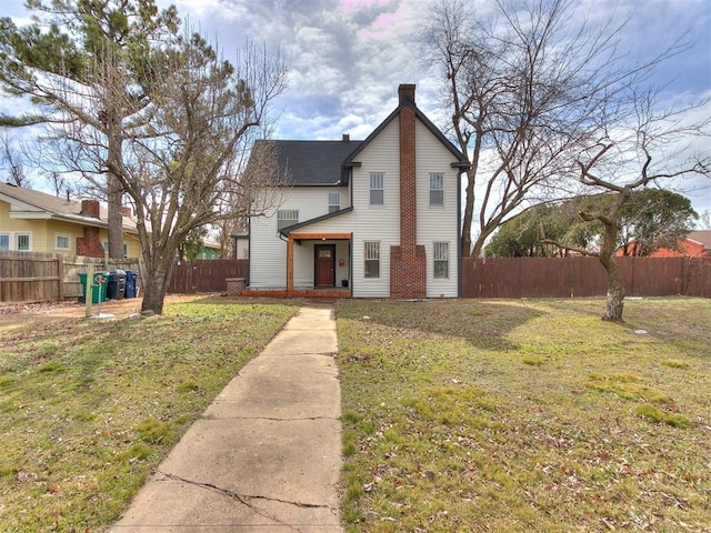 view of front of home with a front lawn