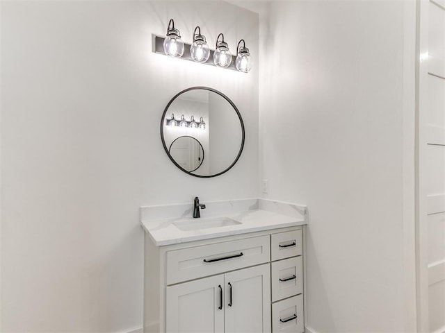 bathroom with baseboards and vanity