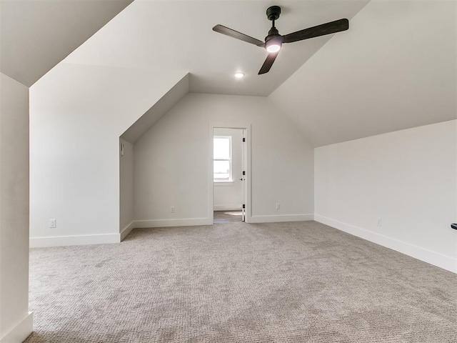 bonus room featuring carpet floors, a ceiling fan, baseboards, and lofted ceiling