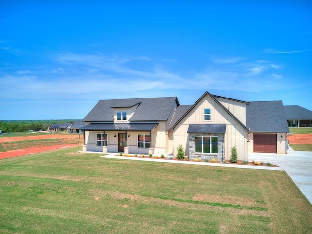 modern farmhouse style home with board and batten siding, a porch, a front lawn, concrete driveway, and an attached garage