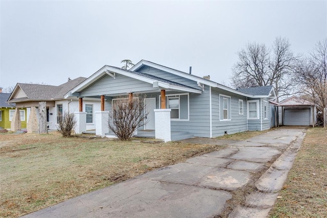 1617 NW 31st St, Oklahoma City, OK 73118 - view of front facade featuring an outbuilding, a garage, and a front lawn