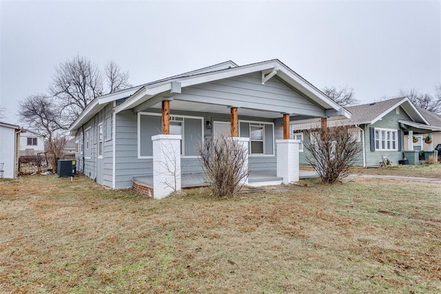 1617 NW 31st St, Oklahoma City, OK 73118 - bungalow-style home with a front lawn, central air condition unit, and a porch