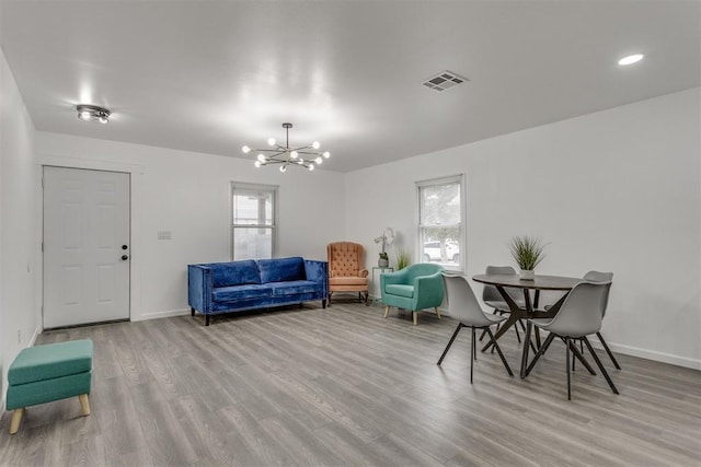 1617 NW 31st St, Oklahoma City, OK 73118 - interior space featuring an inviting chandelier and light hardwood / wood-style floors