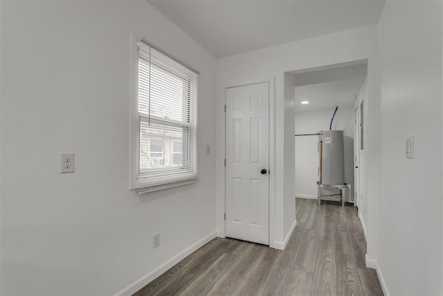 1617 NW 31st St, Oklahoma City, OK 73118 - interior space with dark hardwood / wood-style floors and water heater