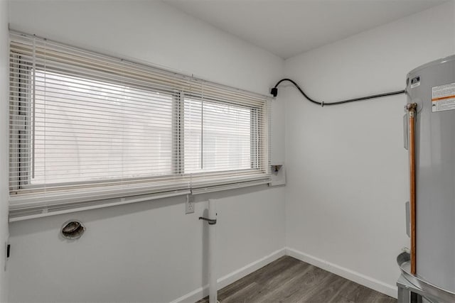 1617 NW 31st St, Oklahoma City, OK 73118 - washroom featuring water heater and dark hardwood / wood-style flooring