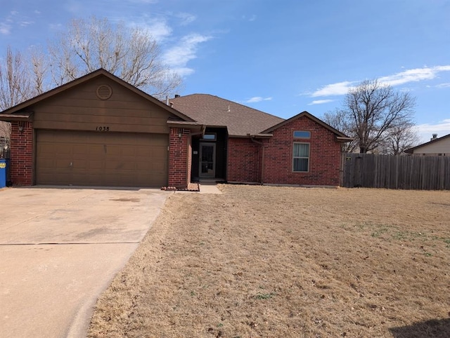 single story home featuring a garage, brick siding, a shingled roof, fence, and concrete driveway