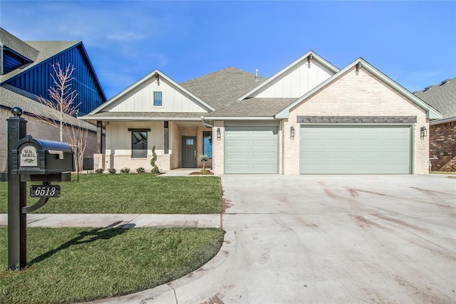 view of front of home with a garage and a front yard