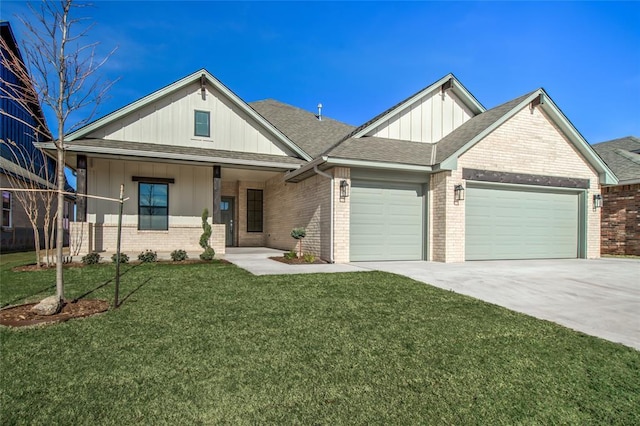 view of front of home with a garage, a front lawn, and a porch