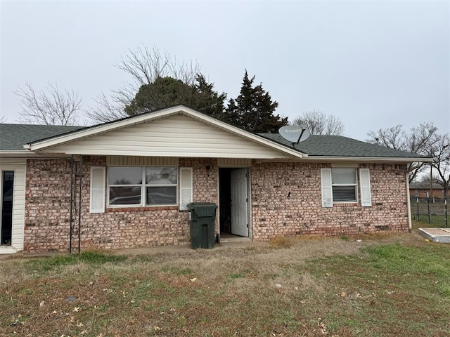 ranch-style house with a front lawn