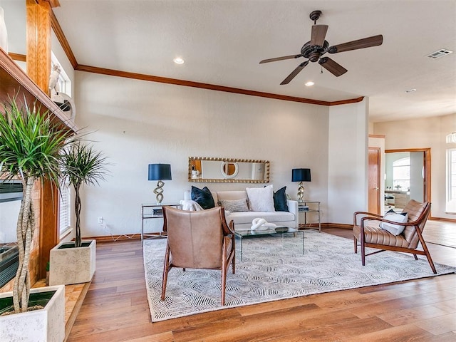 2508 Hamden Ave, Norman, OK 73069 - living area with ceiling fan, visible vents, crown molding, wood finished floors, and baseboards