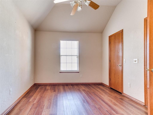 2508 Hamden Ave, Norman, OK 73069 - spare room with baseboards, a ceiling fan, wood finished floors, and lofted ceiling