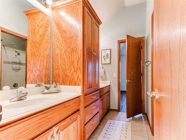 2508 Hamden Ave, Norman, OK 73069 - full bath with vanity, tile patterned flooring, vaulted ceiling, and a shower