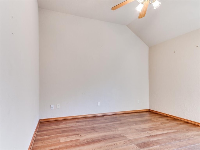 2508 Hamden Ave, Norman, OK 73069 - unfurnished room with baseboards, ceiling fan, vaulted ceiling, and wood finished floors