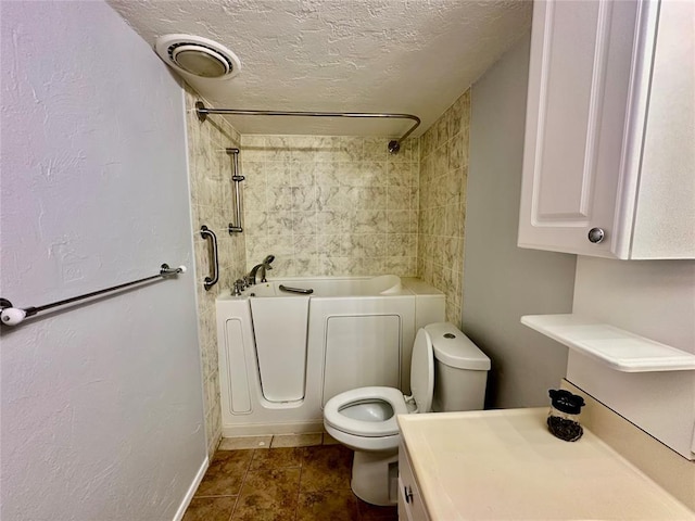 7191 NW 16th St, Bethany, OK 73008 - bathroom with toilet and a textured ceiling