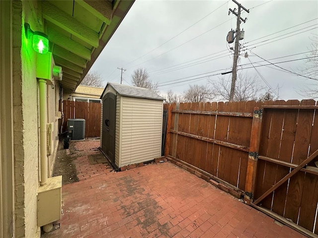 7191 NW 16th St, Bethany, OK 73008 - view of patio / terrace featuring a storage unit and central air condition unit