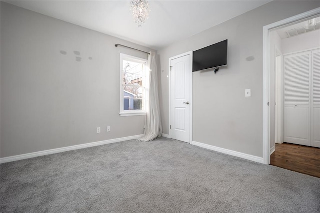 unfurnished bedroom with carpet floors