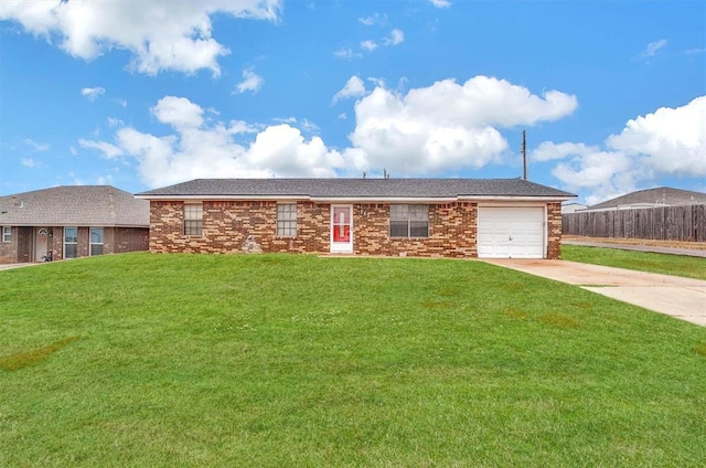 ranch-style house with a garage and a front yard