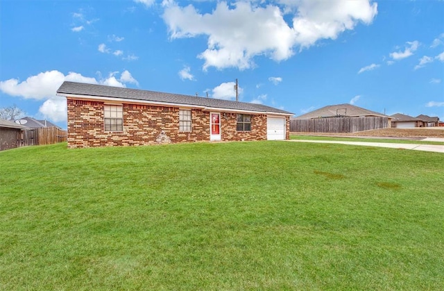 ranch-style home with a garage and a front yard